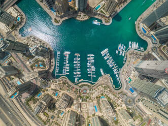 Aerial view of Dubai Marina with moored boats and skyscrapers, UAE. - AAEF02337