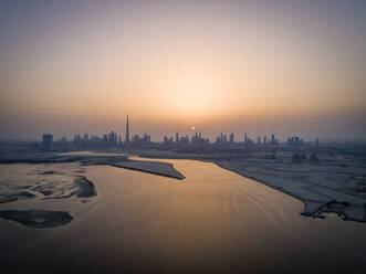 Aerial view of Dubai skyscrapers at sunset, UAE. - AAEF02350