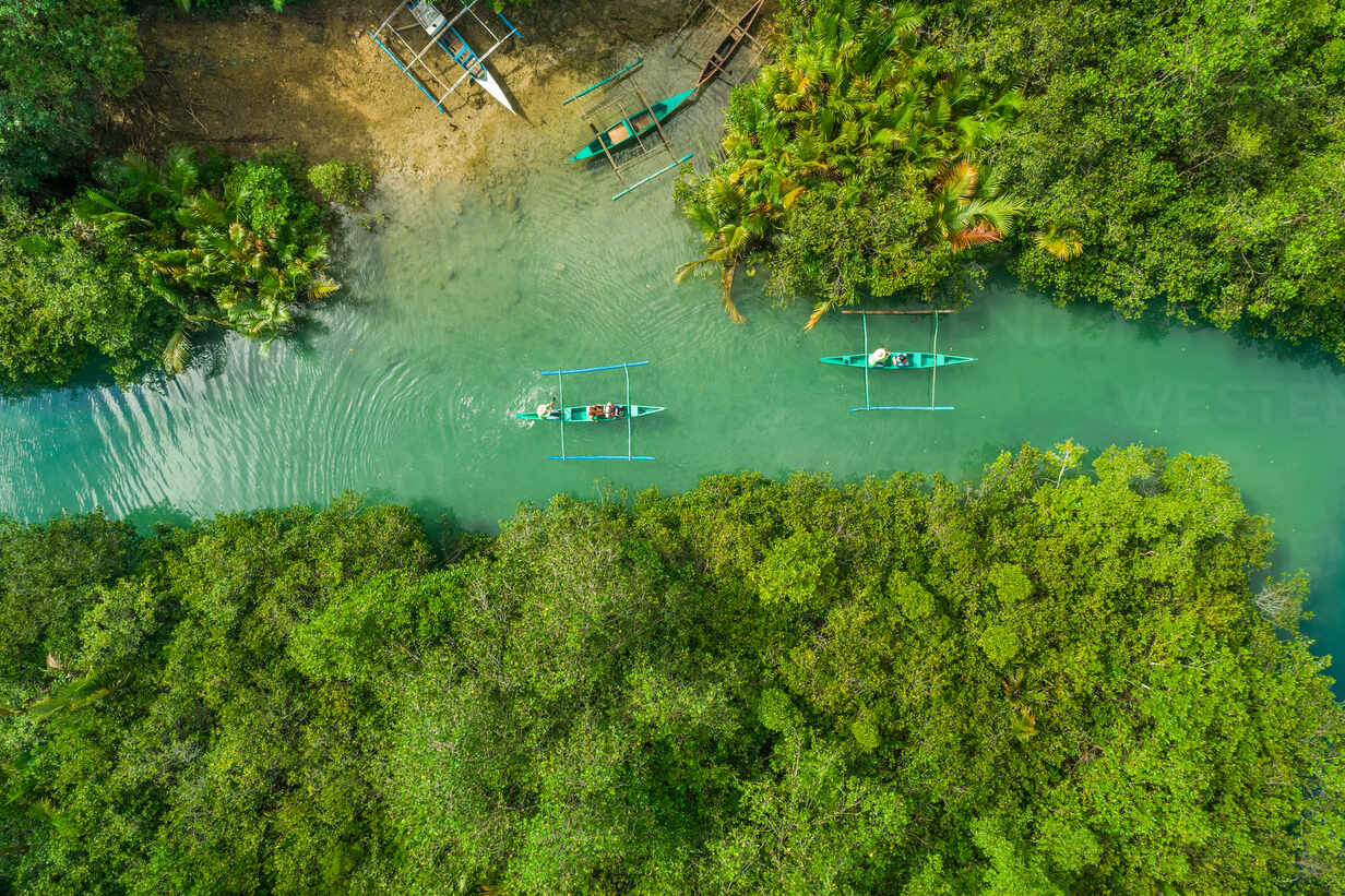 Aerial view of traditional fishing boats in Bojo River, Aloguinsan,  Philippines. stock photo