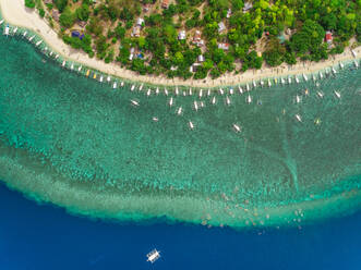 Aerial view of beach, buildings, filipino boats, Balicasag Island, Philippines. - AAEF02409