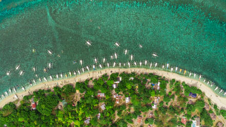 Aerial view of beach, buildings, filipino boats, Balicasag Island, Philippines. - AAEF02410