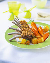 Lamb chop with carrots in plate on table - PPXF00247