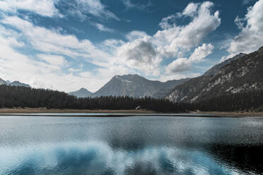 Scenic view of Lake Palu against cloudy sky in Italy - DWIF01019