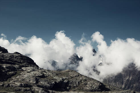 Low angle view of mountains and clouds at Lombardy, Italy - DWIF01024