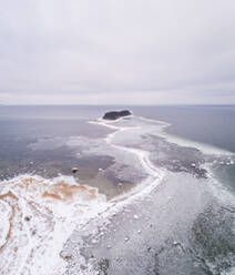 Aerial view of the frozen sea on the coast of Kasmu in Estonia. - AAEF02458