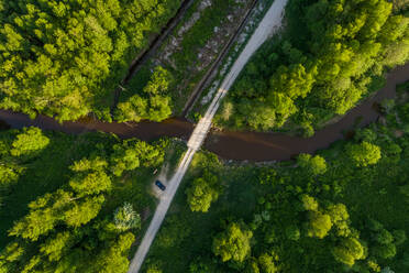 Aerial view of bridge crossing river, Estonia. - AAEF02596