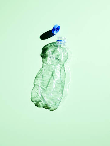 Plastic bottle on green background stock photo