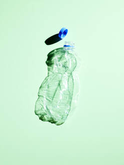 Plastic bottle on green background - KSWF02083