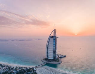 Aerial view of the luxurious Burj Al Arab Hotel at sunset in Dubai, U.A.E. - AAEF02712