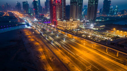 Aerial view of illuminated skyscrapers in downtown Dubai at night, U.A.E. - AAEF02778