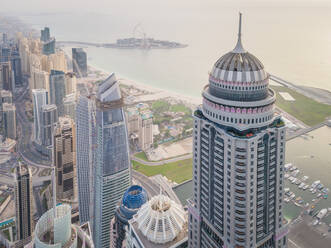 Aerial view of modern towers and bay of Dubai, U.A.E. - AAEF02783