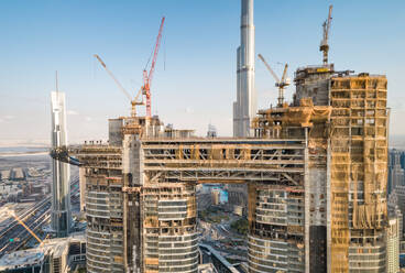 Aerial view of skyscrapers under construction close by the Burj Khalifa tower in Dubai, U.A.E. - AAEF02875