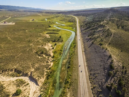 Aerial view of sevier blue river following the road in Hatch, Utah, USA. - AAEF03019