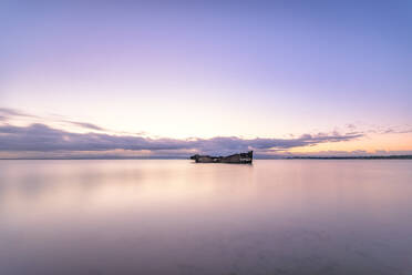 Janie Seddon shipwreck against sky during sunset, Moeraki, New Zealand - SMAF01276