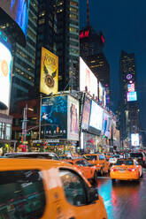 Yellow taxis in Times Square at night. New York City, New York, United States of America, North America - RHPLF00734