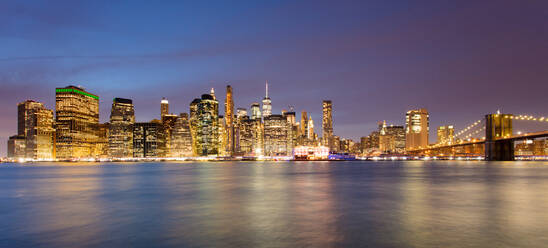 Lower Manhattan skyline and Brooklyn Bridge at dawn, New York City, New York, United States of America, North America - RHPLF00738