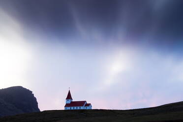 Hilltop church against twilight sky, Vik i Myrdal, southern area, Iceland, Polar Regions
 - RHPLF00808