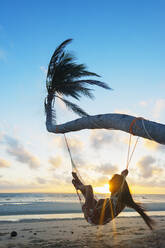 Girl in hammock on Sugar Beach, Bantayan Island, Cebu, The Visayas, Philippines, Southeast Asia, Asia - RHPLF00876