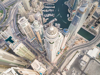 Aerial view of towers surrounding harbour in Dubai Marina, U.A.E. - AAEF03176