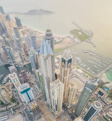 Aerial view of towers surrounding harbour in Dubai Marina, U.A.E. - AAEF03183