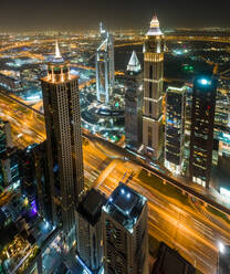 Aerial view of illuminated skyscrapers in Dubai at night, U.A.E. - AAEF03206