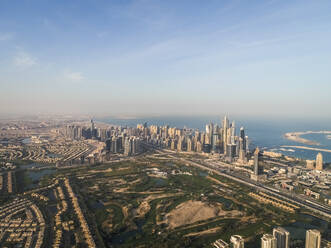 Aerial view of skyscrapers and Emirates Hills park in Dubai, United Arab Emirates. - AAEF03230