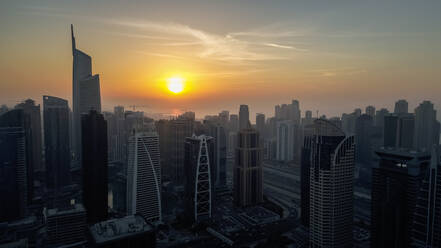 Aerial view of skyscrapers at sunset in Dubai, United Arab Emirates. - AAEF03308