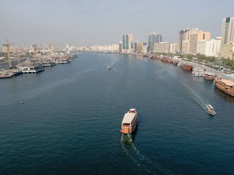 Aerial view of a wooden dhow in Dubai canal, United Arab Emirates. - AAEF03336