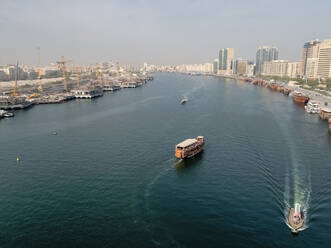 Aerial view of a wooden dhow in Dubai canal, United Arab Emirates. - AAEF03337