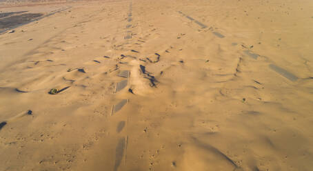 Aerial view of highway covered with sand in the desert of Dubai, United Arab Emirates. - AAEF03380