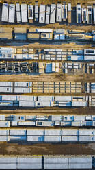 Aerial view of finished concrete slabs and related products at a concrete manufacturing facility in the afternoon sun in Aurora, IL, USA - AAEF03428