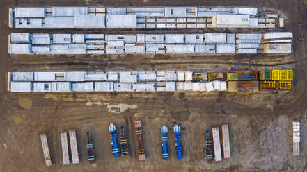 Aerial view of finished concrete slabs and related products at a concrete manufacturing facility in the afternoon sun in Aurora, IL, USA - AAEF03429