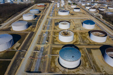 LEMONT, IL, USA - APRIL 20, 2019: Aerial view of a petro chemical processing plant and storage facilities in early morning light. - AAEF03461