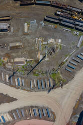 Aerial view of scrap metals and finished flat rolled steel products at a modern steel producing facility on the shores of Lake Michigan in Indiana. - AAEF03523