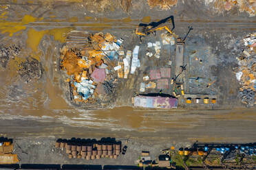 Aerial view of scrap metals and finished steel products at a modern steel producing facility on the shores of Lake Michigan in Indiana. - AAEF03534