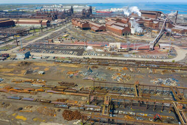 BURNS HARBOR, INDIANA, USA - MAY 14, 2019: Aerial view of a modern steel producing facility on the shores of Lake Michigan in Indiana, USA - AAEF03536