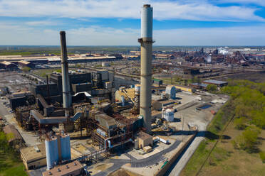 BURNS HARBOR, INDIANA, USA - MAY 14, 2019: Aerial view of a modern steel producing facility on the shores of Lake Michigan in Indiana, USA - AAEF03540
