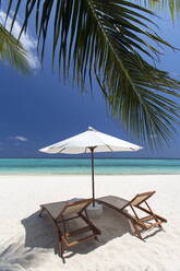 Lounge chairs on tropical beach, Maldives, Indian Ocean, Asia - RHPLF01096