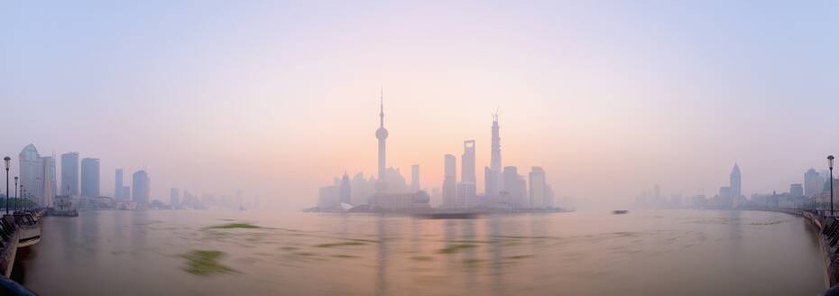 Pudong skyline across Huangpu River, including Oriental Pearl Tower, Shanghai World Financial Center, and Shanghai Tower, Shanghai, China, Asia - RHPLF01106