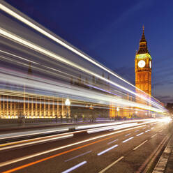 Motion blurred red double decker bus, Houses of Parliament, Big Ben, Westminster Bridge, London, England, United Kingdom, Europe - RHPLF01155