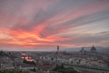 Pink clouds at sunset frame the city of Florence crossed by Arno River seen from Piazzale Michelangelo, Florence, Tuscany, Italy, Europe - RHPLF01392