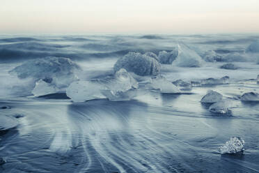 Icebergs on Jokulsarlon black ice beach, Iceland, Polar Regions - RHPLF01510