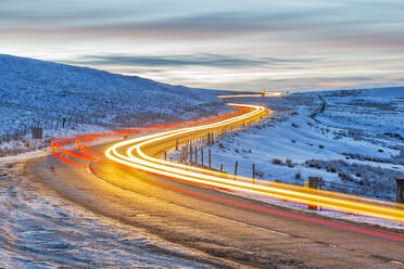 View of trail lights on frozen landscape near Buxton at dusk, High Peak, Derbyshire, England, United Kingdom, Europe - RHPLF01607