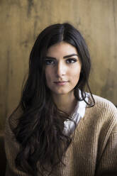 Portrait of young woman with dark long hair - ABZF02425