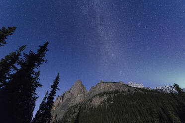 Milky way rises over the Canadian Rockies in the Yoho National Park, with moonlight cast on the mountain and Aurora over horizon, UNESCO World Heritage Site, Canadian Rockies, Alberta, Canada, North America - RHPLF01921