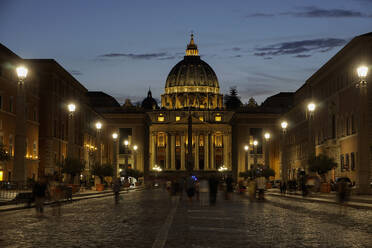 St. Peter's Cathedral night view with passing crowd, from Via della Conciliazione, Rome, Lazio, Italy, Europe - RHPLF01936