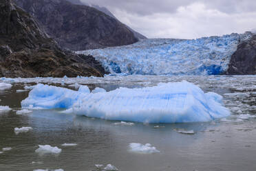 Ice pack and blue ice face of South Sawyer Glacier, mountain backdrop, Stikine Icefield, Tracy Arm Fjord, Alaska, United States of America, North America - RHPLF02230