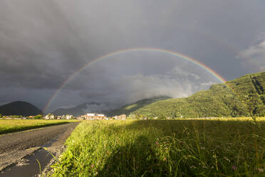 Rainbow over green fields of countryside, Cosio Valtellino, Sondrio province, Valtellina, Lombardy, Italy, Europe - RHPLF02240