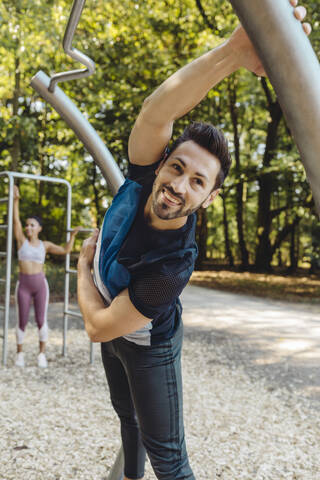 Man stretching on fitness trail stock photo