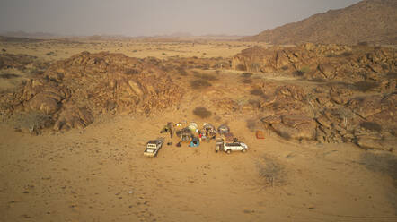 Aerial view of expedition of 4x4 cars, Camp in the Iona National Park, Angola, Africa - VEGF00533